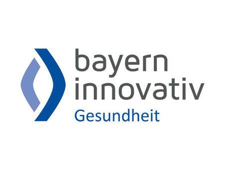 Logo von Bayern Innovativ Gesundheit mit modernen, geschwungenen Elementen in Blau und Gr&uuml;n.